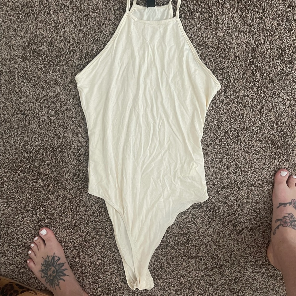 High neck, thong body suit